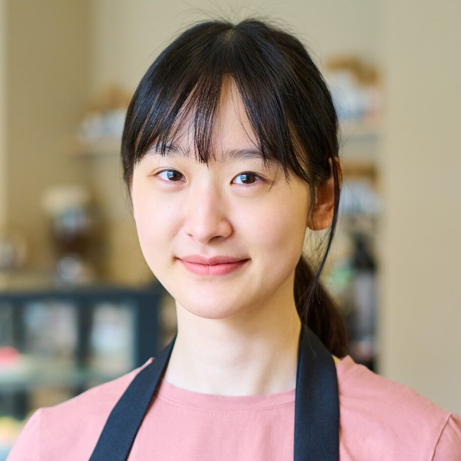 Smiling Asian waitress in cafe
